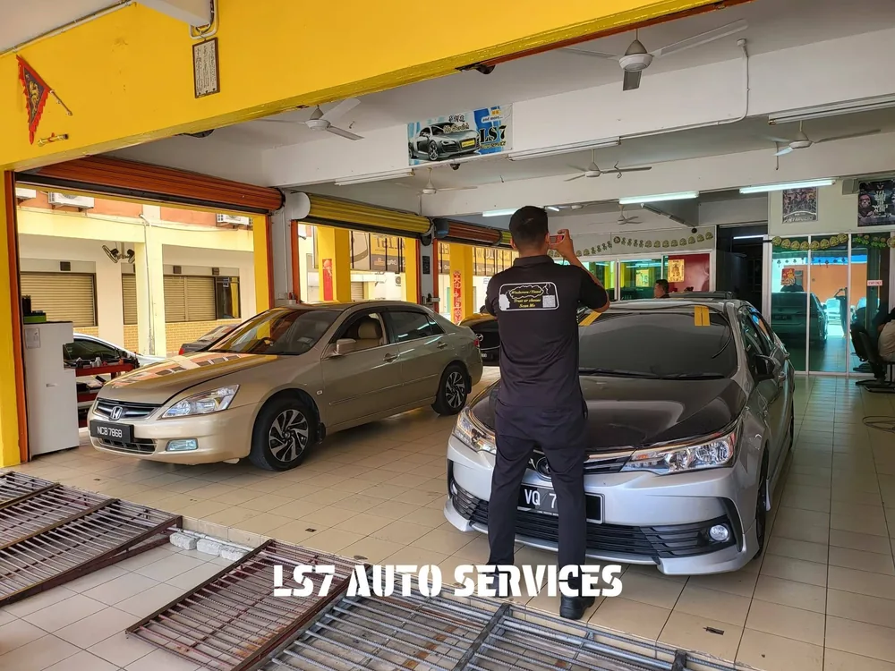 LS7 team member attending to a vehicle inside the workshop