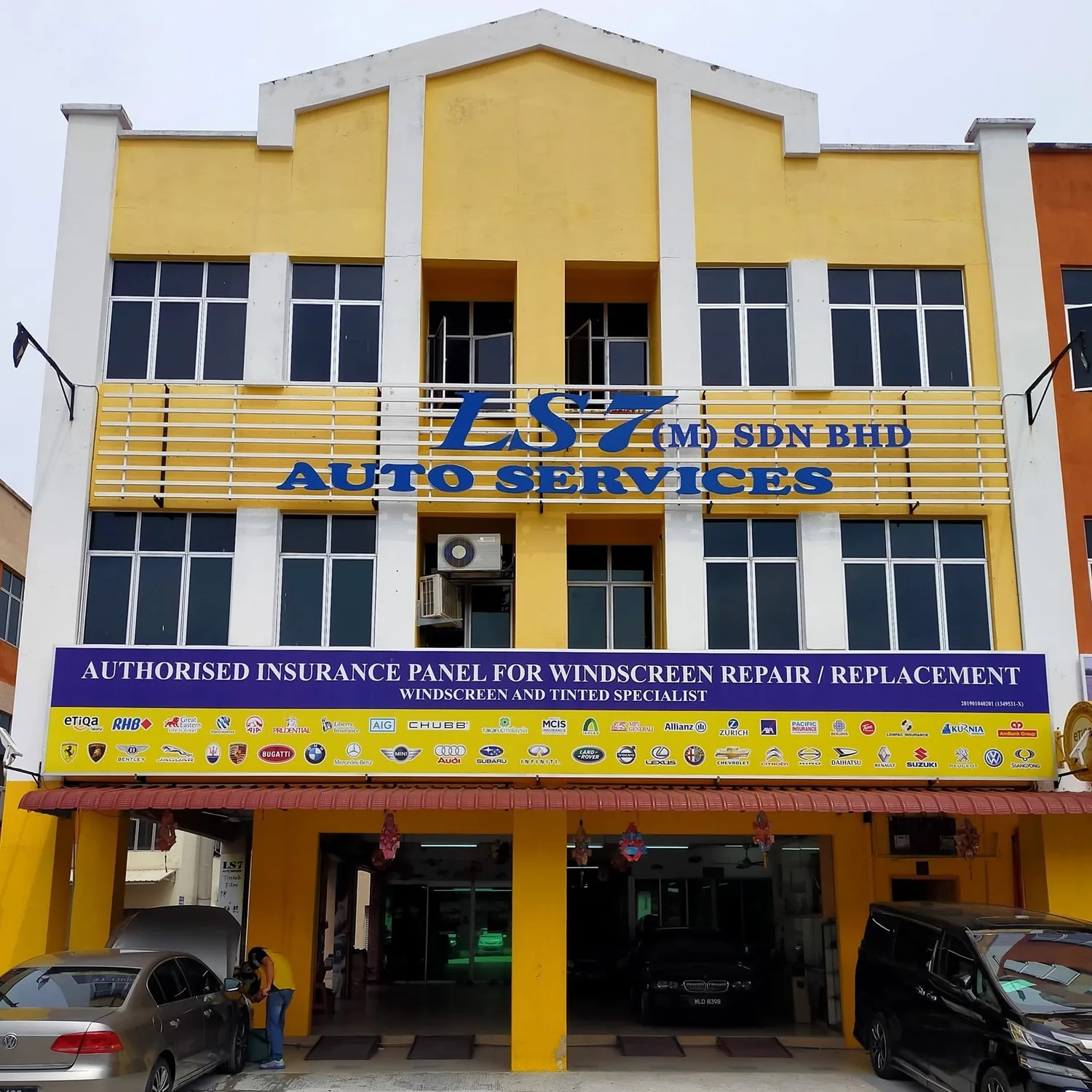 LS7 Auto Services workshop with its yellow facade in Seremban